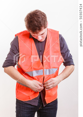 Male worker in safety vest. Male worker in safety vest. 50307414