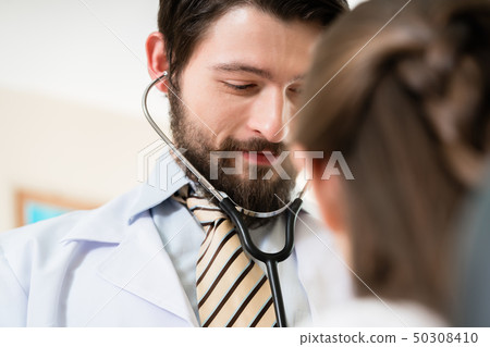 Doctor checking patient 50308410