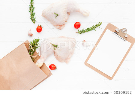 Fresh raw chicken legs with herbs. Cooking concept Fresh raw chicken legs with herbs. Cooking concept 50309192