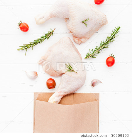 Fresh raw chicken legs with herbs. Cooking concept Fresh raw chicken legs with herbs. Cooking concept 50309193