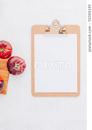 Tomatoes Mar Azul on white wooden table background Tomatoes Mar Azul on white wooden table background 50309195
