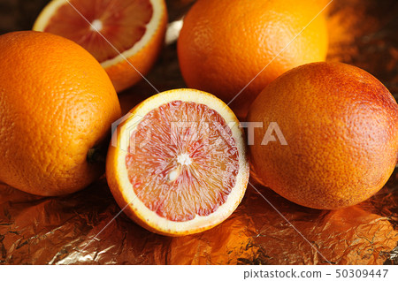 red oranges on gold foil red oranges on gold foil 50309447