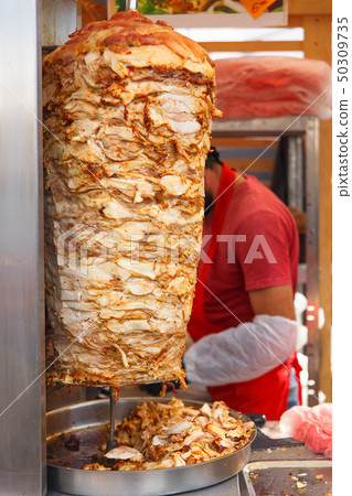 A large piece of chicken meat layered 50309735