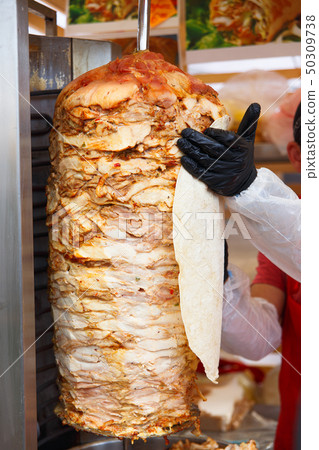 Chef lubricate pita bread 50309738