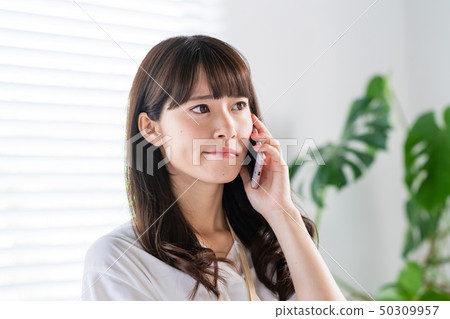 Young woman, smartphone, businesswoman, office casual Young woman, smartphone, businesswoman, office casual 50309957