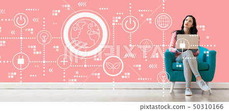 Green eco earth concept with woman using a laptop 50310166