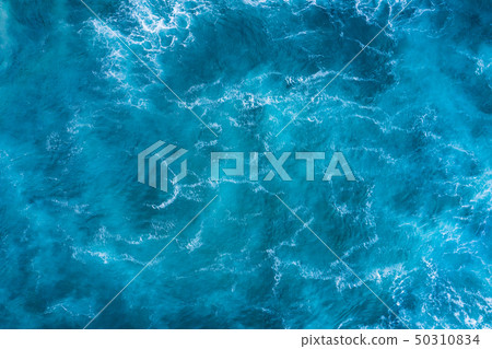 Top view of blue frothy sea surface. Shot in the Top view of blue frothy sea surface. Shot in the 50310834