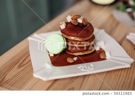 Stack of delicious homemade pancakes with almond Stack of delicious homemade pancakes with almond 50311983