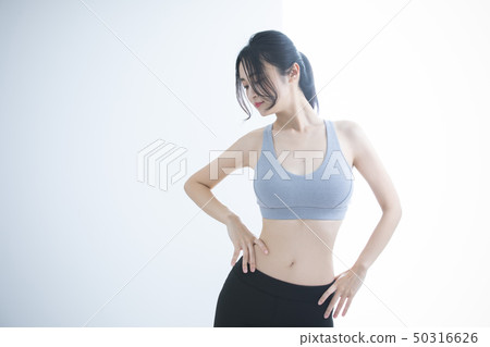 Young woman exercise 50316626