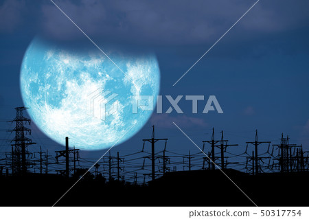 blue milk moon back on silhouette electric pole on blue milk moon back on silhouette electric pole on 50317754