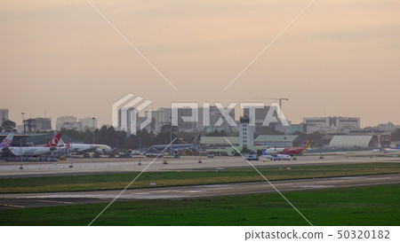 Passenger airplanes docking at the airport Passenger airplanes docking at the airport 50320182