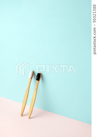Bamboo teeth brush on minimalistic backgroud. zero 50321388