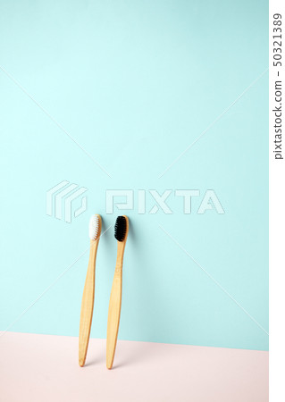Bamboo teeth brush on minimalistic backgroud. zero 50321389