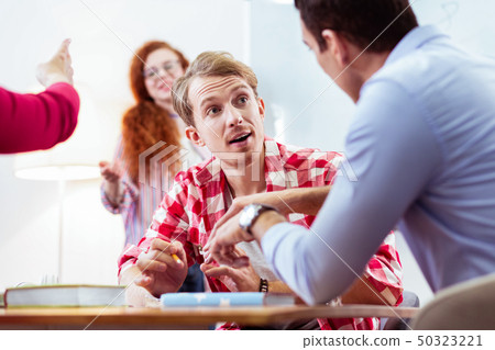 Nice handsome man speaking to his friend 50323221