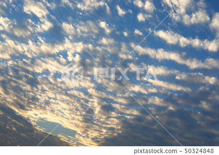 beautiful moving cloud above dramatic blue sunset 50324848