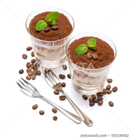 two portions Classic tiramisu dessert in a glass isolated on a white background 50326002