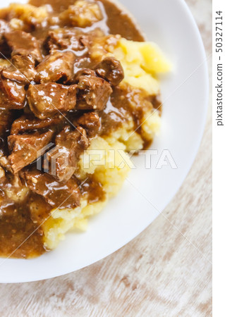 Braised beef, beef stroganoff with gravy on mashed Braised beef, beef stroganoff with gravy on mashed 50327114