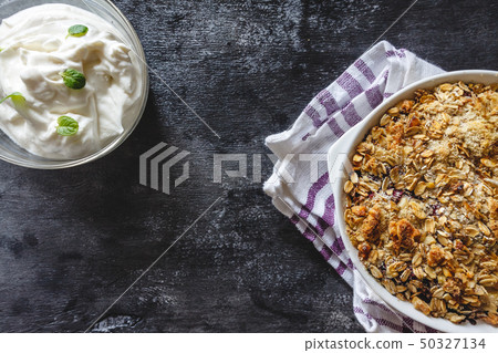 Granola and curd creamy tzoghurt with mint on a 50327134