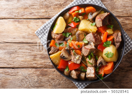 ragout of pork with mushrooms and vegetables 50328541