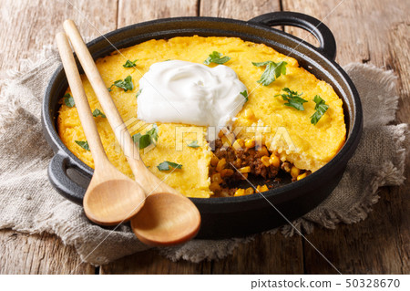 Tamale pie casserole served with sour cream 50328670