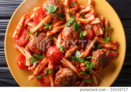Tasty pasta Casarecce with meatballs in tomato 50328717