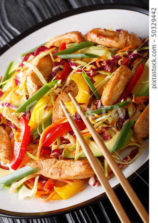 Asian cabbage salad with chicken and vegetables 50329442