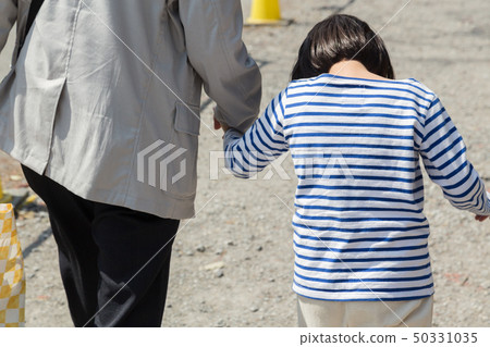 Child holding hands with grandpa Child holding hands with grandpa 50331035