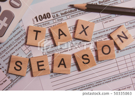 Tax season with wooden alphabet blocks, 50335863