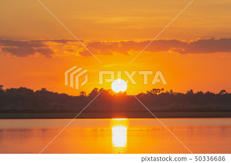 Sunset in the lake. beautiful sunset behind the 50336686