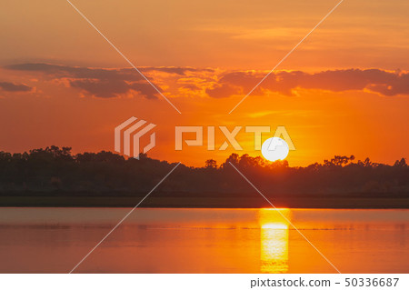 Sunset in the lake. beautiful sunset behind the 50336687