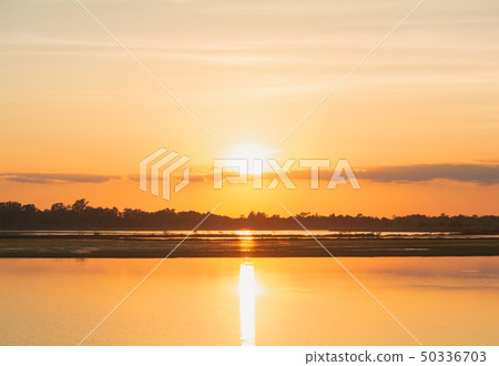 Sunset in the lake. beautiful sunset behind the 50336703
