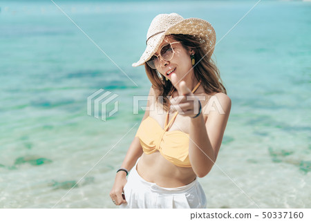 Cheerful girl wears bikini and white hat Cheerful girl wears bikini and white hat 50337160
