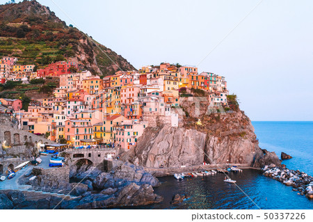 Stunning view of the beautiful and cozy village of Manarola in the Cinque Terre Reserve at sunset. Stunning view of the beautiful and cozy village of Manarola in the Cinque Terre Reserve at sunset. 50337226