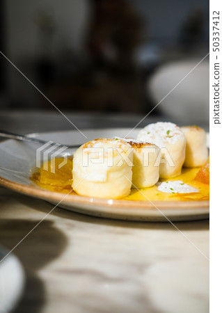 Cottage cheese pancakes with orange jam Cottage cheese pancakes with orange jam 50337412