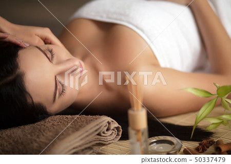 Woman having a massage in a spa 50337479