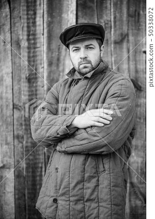 Portrait of old-fashioned man, monochrome. Concept 50338072