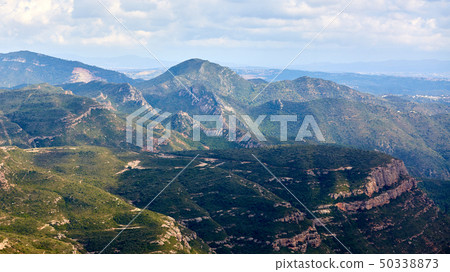 Breathtaking view to Montserrat mountain range on a sunny summer day near Barcelona, Catalonia 50338873