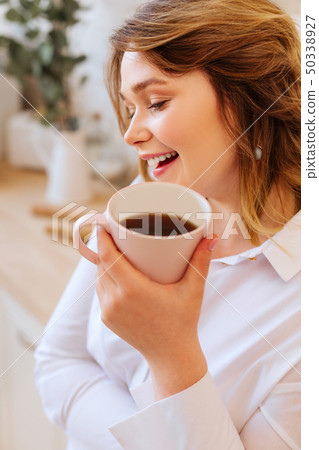 Happy delighted woman being in a great mood 50338927