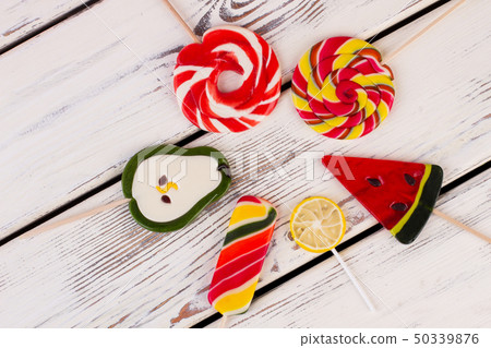 Composition with colorful lollipops, top view. Composition with colorful lollipops, top view. 50339876