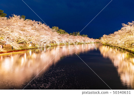 A lighted up view of the "Hirosaki Castle Saijo" from the Haruyo Bridge A lighted up view of the "Hirosaki Castle Saijo" from the Haruyo Bridge 50340631