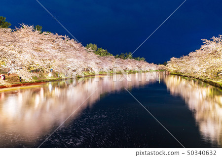 A lighted up view of the "Hirosaki Castle Saijo" from the Haruyo Bridge A lighted up view of the "Hirosaki Castle Saijo" from the Haruyo Bridge 50340632