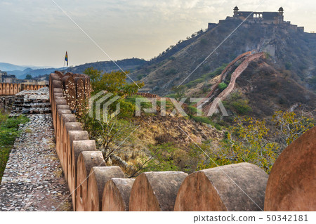 Ancient long wall with towers around Amber Fort 50342181