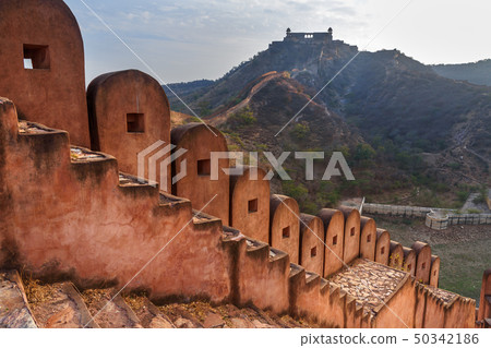 Ancient long wall with towers around Amber Fort, Ancient long wall with towers around Amber Fort, 50342186