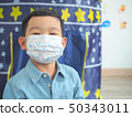 Little boy wearing protective mask protection from 50343011