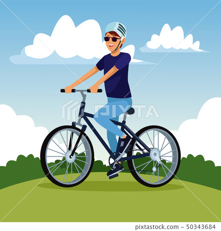 Young man riding bike Young man riding bike 50343684