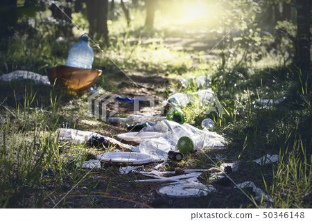 Pile of garage on green grass in the nature 50346148