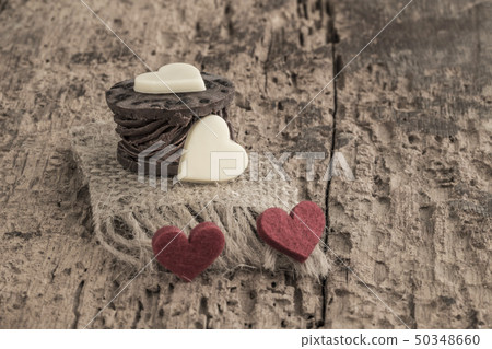 heart shaped chocolate bars on wooden table heart shaped chocolate bars on wooden table 50348660
