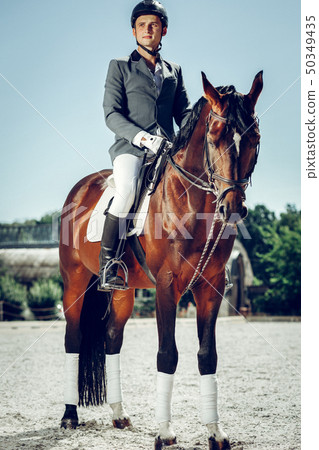 Handsome nice man wearing special uniform for riding Handsome nice man wearing special uniform for riding 50349435