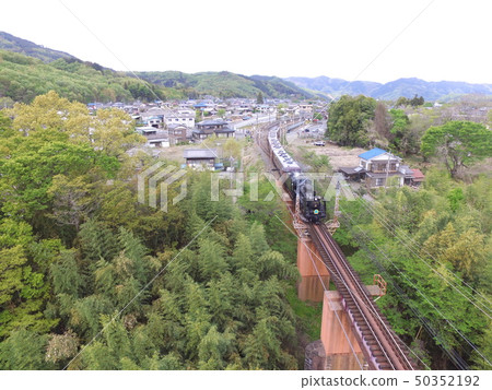 SL crossing the Arakawa bridge "Pareo Express" ~ Aerial photograph with drone (Nagami Town of Chichibu-cho, Chichibu-gun, Saitama Prefecture · Shinodano-cho Shimodano) 50352192