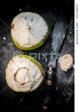 Coconut fruit with knife Coconut fruit with knife 50356047